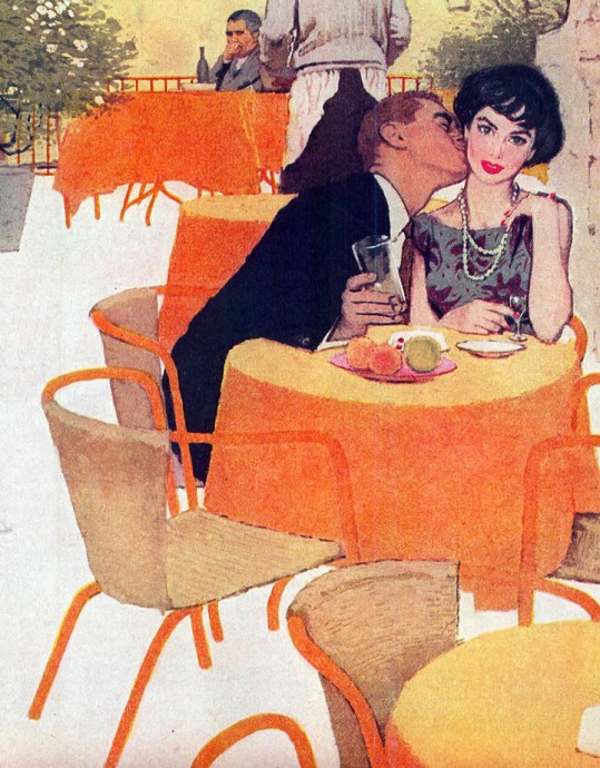 Парень целует девушку в кафе